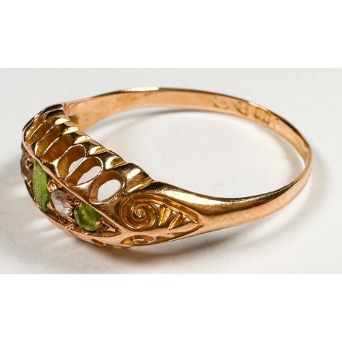 257 - An 18ct yellow gold dress ring, set with three oval shaped peridot stones and two old-cut diamonds, ... 