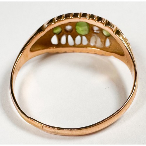 257 - An 18ct yellow gold dress ring, set with three oval shaped peridot stones and two old-cut diamonds, ... 