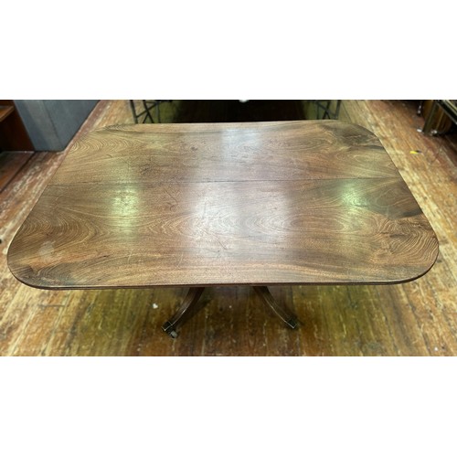 704 - A Regency mahogany shaped-rectangular tilt-top table, on ring turned tapering stem, quadripartite ba... 