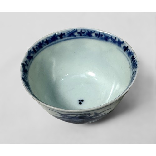 93 - Nanking Cargo 18th Century blue and white Chinese tea bowl and saucer, 1752, decorated with a pagoda... 