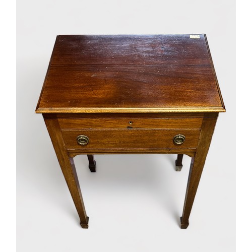 383 - An early 20th century stained walnut work table, of rectangular form with hinged top enclosing velve... 