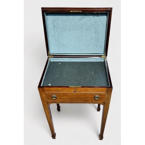 383 - An early 20th century stained walnut work table, of rectangular form with hinged top enclosing velve... 