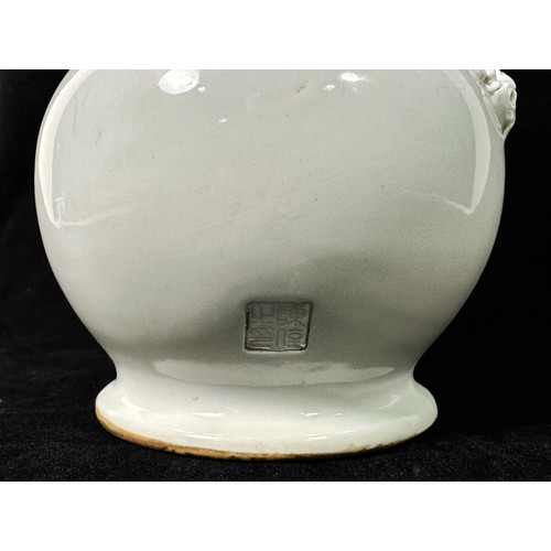 96 - A Chinese Blanc De Chine or Dehua porcelain twin-handled vase, of bulbous double-gourd form, applied... 