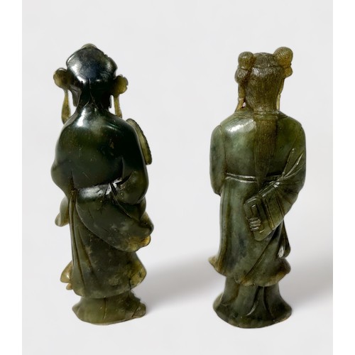 95 - A pair of Chinese carved soapstone standing figures of women holding fans, incised character marks t... 
