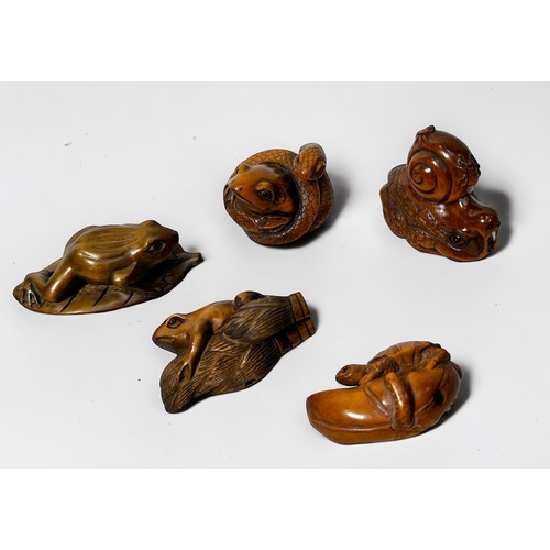 85 - Five various Japanese carved and stained boxwood netsuke,  frog on leaf, frog with coiled snake, sna... 