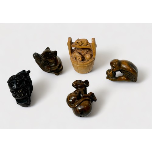 91 - Five various Japanese carved and stained boxwood Netsuke, signed, including monkey holding a peach, ... 