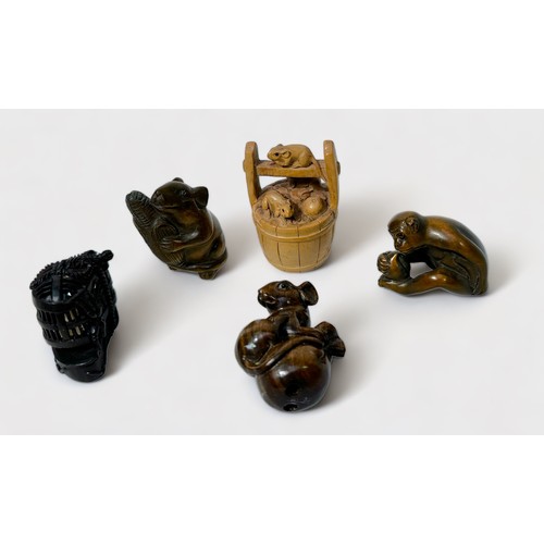 91 - Five various Japanese carved and stained boxwood Netsuke, signed, including monkey holding a peach, ... 