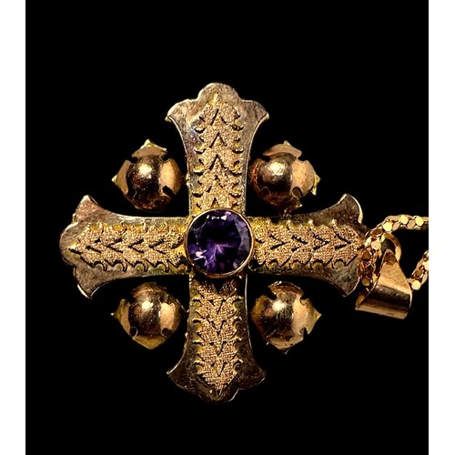 267 - A yellow metal, tests as 14ct gold, Jerusalem cross pendant, centrally bezel set with an amethyst co... 