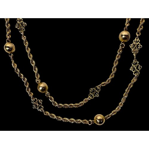 265 - A yellow metal, tests as 14ct gold or above, rope twist necklace, with alternating beads and pierced... 