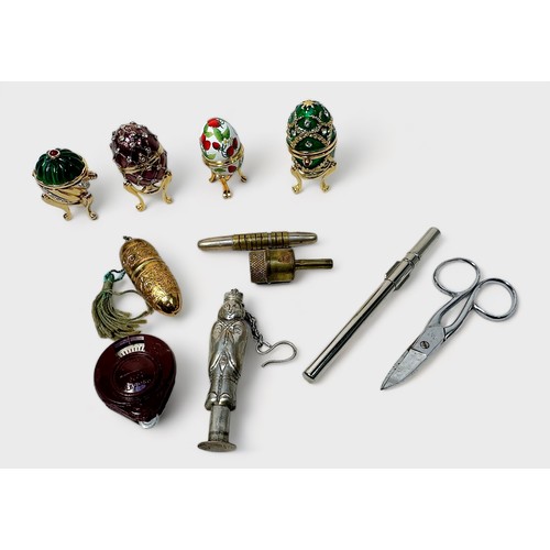 417 - A collection of sewing accessories and notions including a Tartan ware needle case and globe bobbin ... 