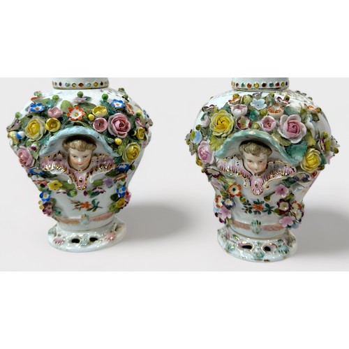 80 - A pair of 19th c entury Dresden 'style' flower-encrusted pierced pot-pourri vases and covers with ch... 