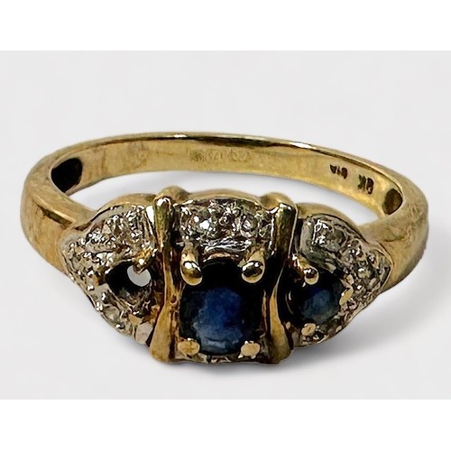 274 - A 9ct gold ring, set with two sapphire coloured stones, one missing and ten small diamonds, together... 