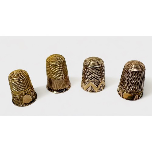 411 - Four various early 20th century gold-cased thimbles