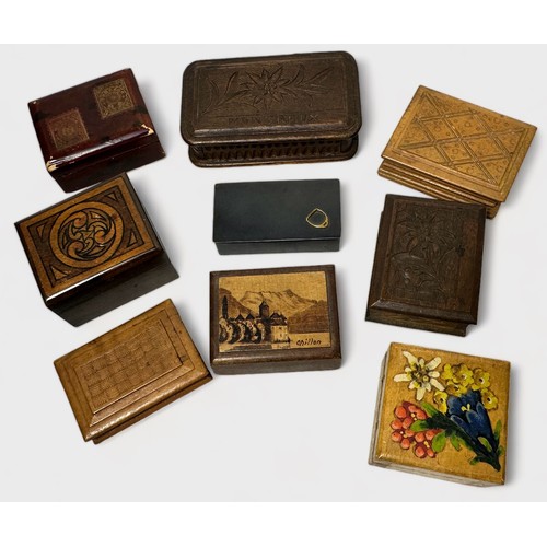 423 - Twenty-six various postage stamp boxes including carved and painted eamples and a patinated metal st... 