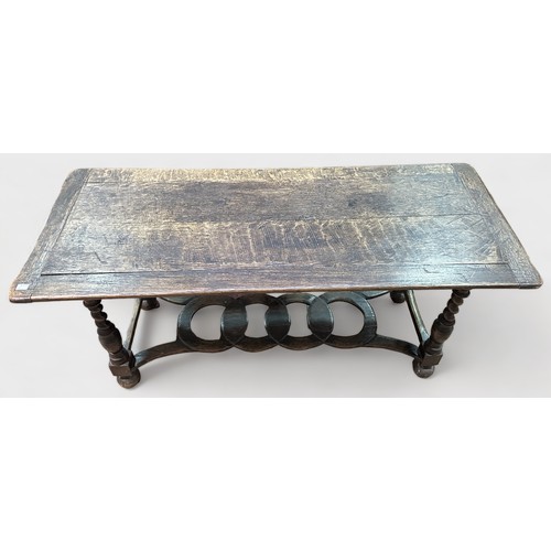 709 - An early 17th Century Oak Side table, of rectangular for with planked top and cleated ends, block-tu... 