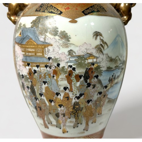 98 - A Japanese Satsuma pottery vase, of baluster form, decorated with figures by water, with a mountaino... 