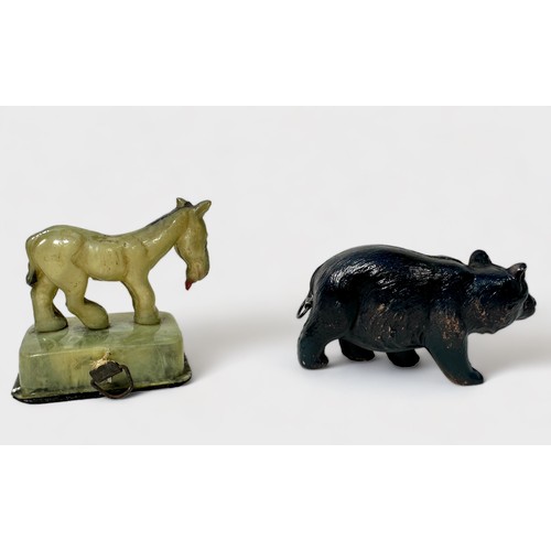 351 - Two celluloid novelty tape measures, one a bear the other 'The Last Horse,' (2)