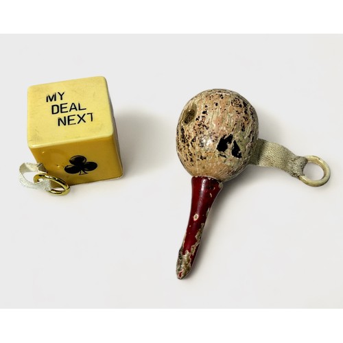 353 - Two Novelty Tape Measures, a celluloid Trumps Dice and a Wooden Maraca, (2)