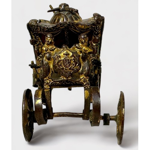 346 - A Novelty Tape Measure modelled as the Royal State Coronation Coach, gilt-brass and metal (gilding w... 