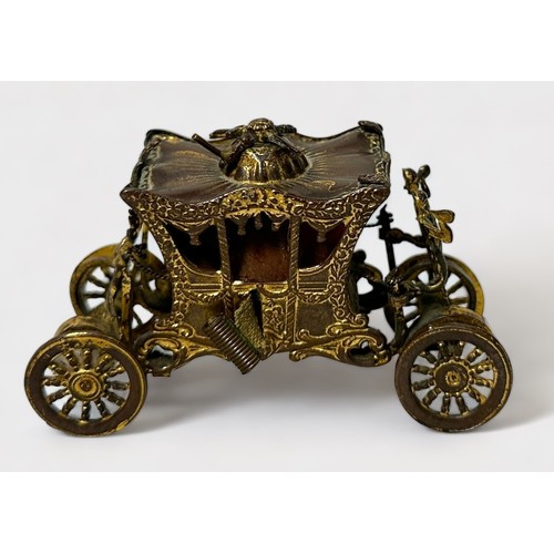 346 - A Novelty Tape Measure modelled as the Royal State Coronation Coach, gilt-brass and metal (gilding w... 