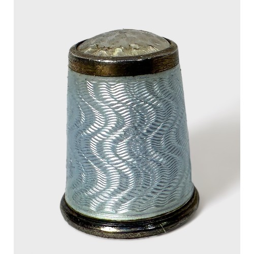 344 - A Norwegian silver and pale blue guilloche enamel thimble with moonstone apex, by David Andersen, ma... 