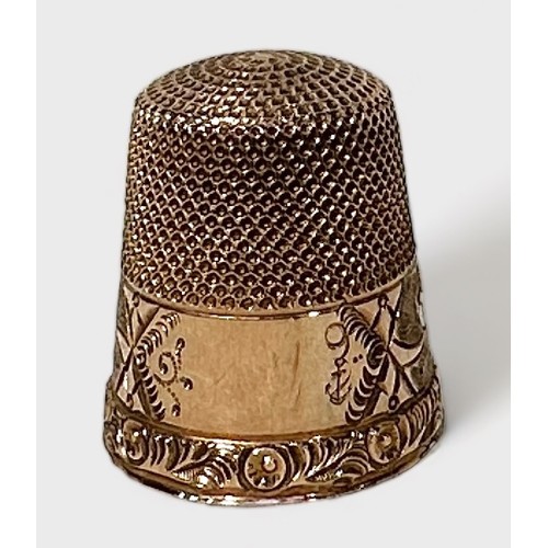 405 - An antique gold thimble, of typical form with dimpled crown and skirt, the frieze with stylised foli... 