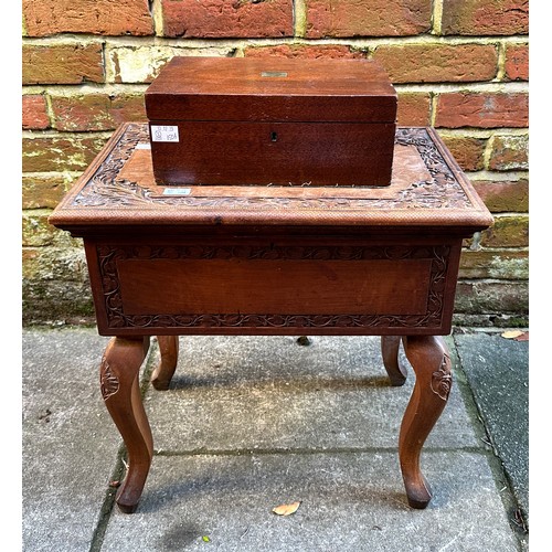 415 - A 20th Century Indian hardwood sewing box, blind fret carved foliate borders, hinged top opens to re... 