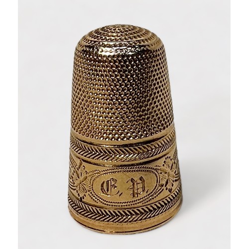 395 - An Antique Gold Thimble, dimpled crown and skirt, the frieze  with a chased bands of foliate oval pa... 