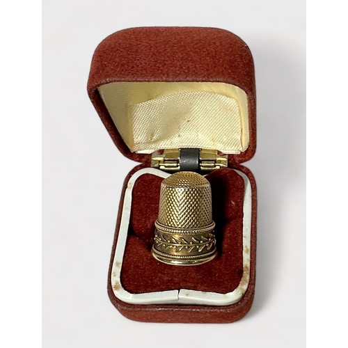 407 - An unmarked Edwardian gold thimble, testing as 14-15ct gold, dimpled crown and diamond-dimpled skirt... 