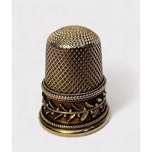 407 - An unmarked Edwardian gold thimble, testing as 14-15ct gold, dimpled crown and diamond-dimpled skirt... 