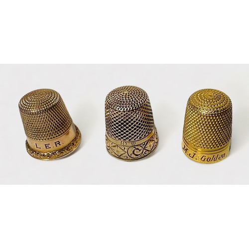 400 - An Edwardian gold thimble, possible 10ct, typical form with dimpled crown and skirt, the lower friez... 