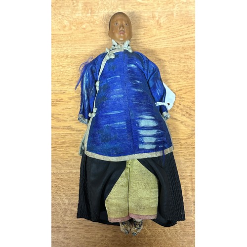 83 - A Chinese carved wooden Door of Hope Mission Doll, circa 1910, finely carved features, painted black... 