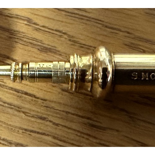 264 - A gold and enamelled propelling pencil by Sampson Mordan & Co. The outer sleeve blue, red and white ... 