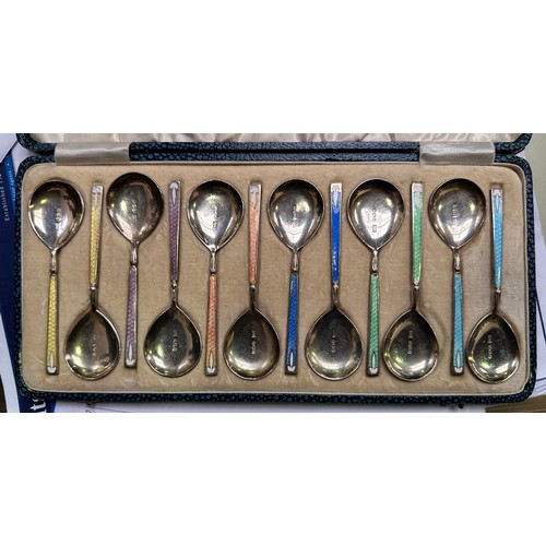 126 - A set of 12 silver and guilloche enamel teaspoons by Walker & Hall, in six colour pairs, hallmarked ... 