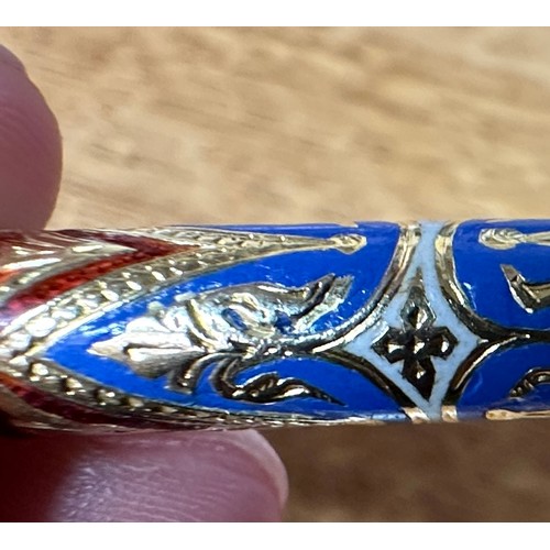 264 - A gold and enamelled propelling pencil by Sampson Mordan & Co. The outer sleeve blue, red and white ... 