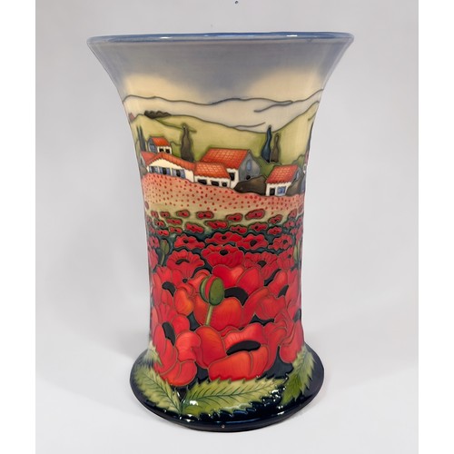 21 - A Moorcroft pottery vase in the Avignon pattern, of cylindrical form with flared rim, designed and s... 