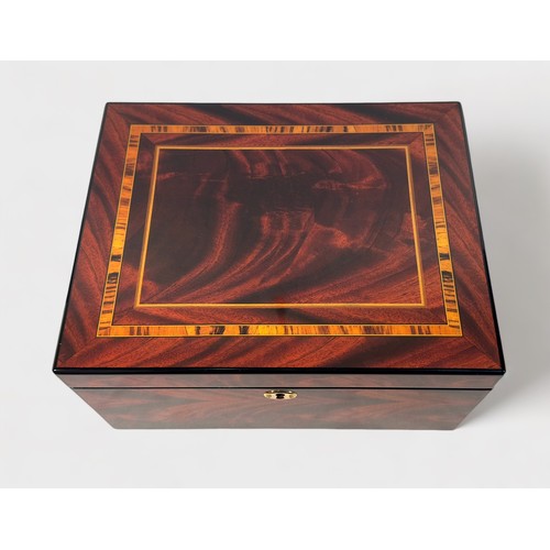 127 - A Rapport London burr wood effect watch box, with lined and compartmented interior with eight sectio... 