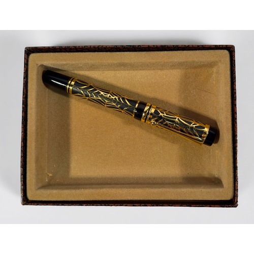 324 - A Laban fountain pen, the entirety with overlaid yellow metal ‘spider web’ decoration, with screw to... 