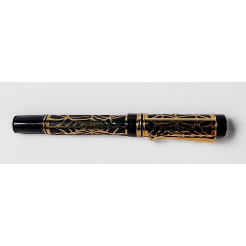 324 - A Laban fountain pen, the entirety with overlaid yellow metal ‘spider web’ decoration, with screw to... 