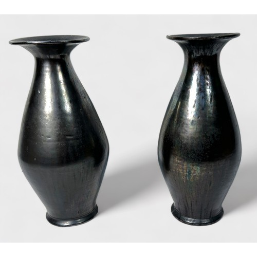 4 - A pair of glazed brown iridescent vases, of tapering ovoid form, with wide flanged neck, metallic fi... 