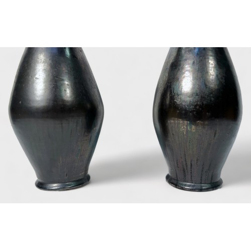 4 - A pair of glazed brown iridescent vases, of tapering ovoid form, with wide flanged neck, metallic fi... 