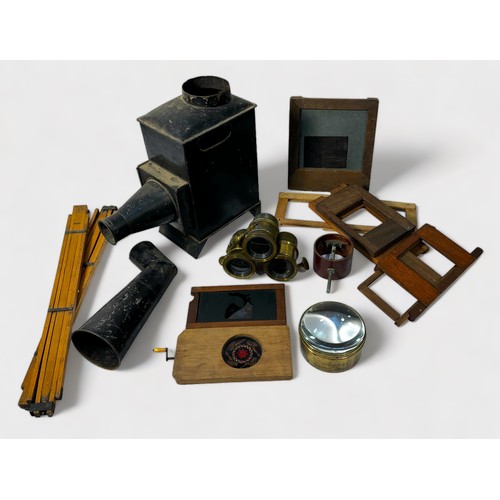 319 - A magic lantern with a collection of assorted painted glass slides depicting portraits, landscapes a... 