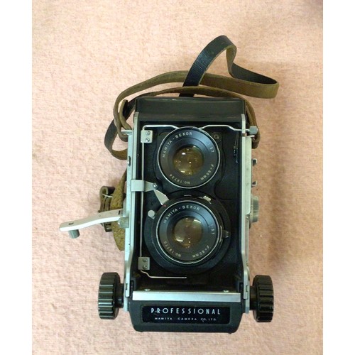 491 - A Mamiya Professional C3 TLR camera, no.239906, with a no.19734 and no.19770 lens, with printed inst... 