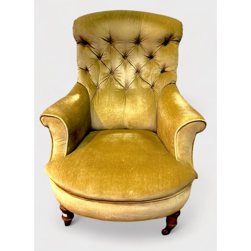 593 - A Victorian button-back armchair, green velvet deep-button upholstery, raised on turned walnut front... 