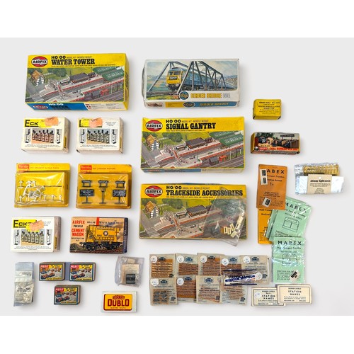 408 - A collection of assorted boxed ‘OO’ gauge build kits, trackside accessories and train and station na... 