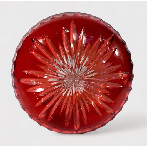 22 - A 19th century Bohemian cranberry glass vase, of compressed globular form with hexagonal neck and fl... 