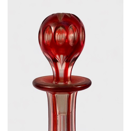 22 - A 19th century Bohemian cranberry glass vase, of compressed globular form with hexagonal neck and fl... 