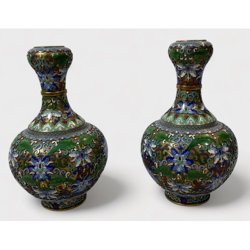 63 - An unusual pair of cloisonné vases, of globular form, with waisted neck to bulbous rim, the entirety... 