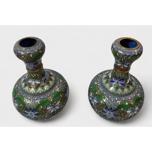 63 - An unusual pair of cloisonné vases, of globular form, with waisted neck to bulbous rim, the entirety... 