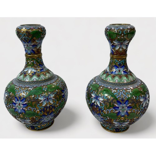 63 - An unusual pair of cloisonné vases, of globular form, with waisted neck to bulbous rim, the entirety... 